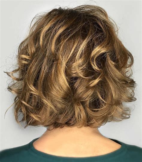 18. Short Shaggy Brunette Bob. When you need an easy-to-style haircut for thick hair, look no further than a short, choppy bob. This one tapers gently to the nape and has slightly longer front pieces that frame the jawline. Side-swept bangs add a touch of asymmetry that really makes the style work. Save. …